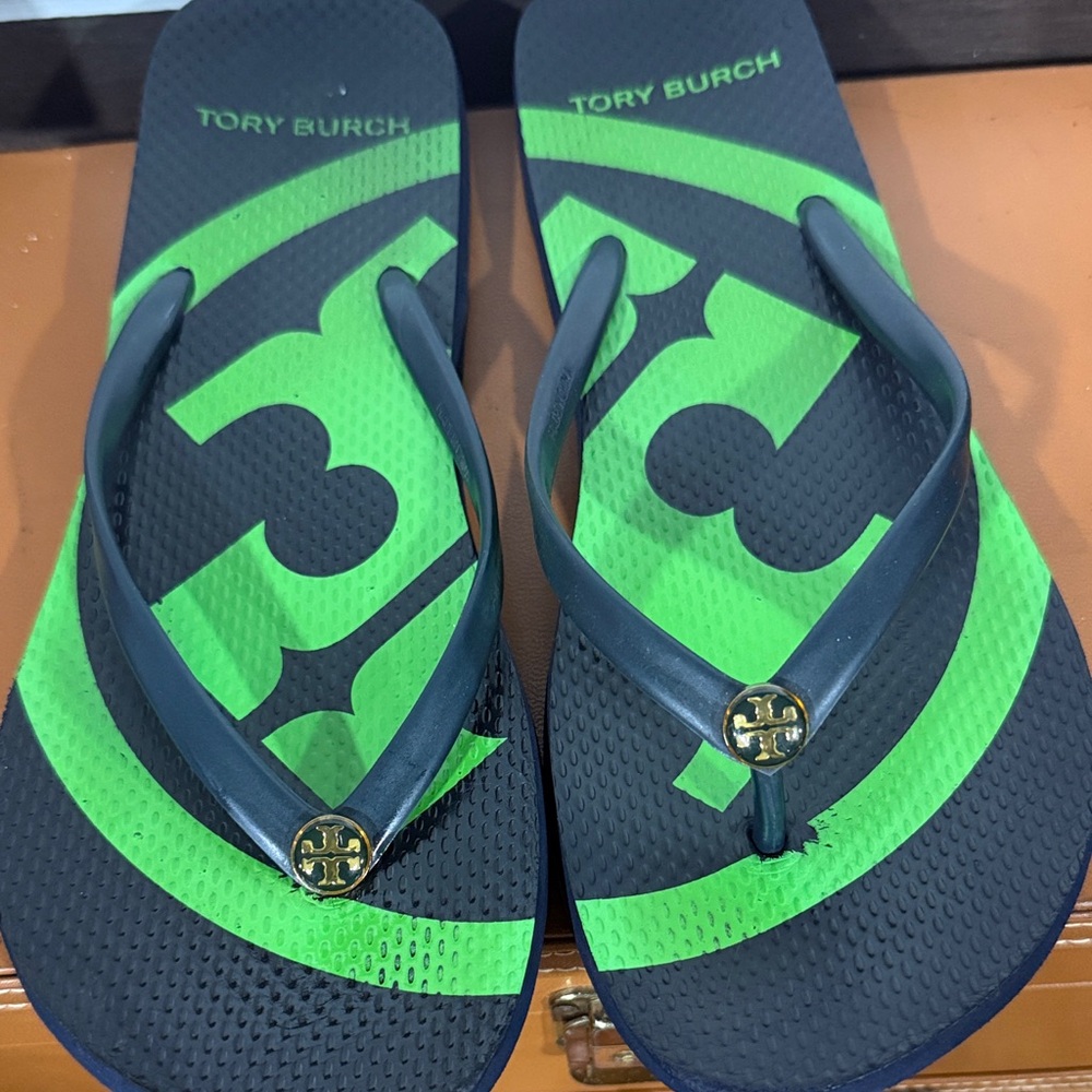 Tory Burch Emory Logo Flip Flops in a green and black colorway - Picture 1 of 8